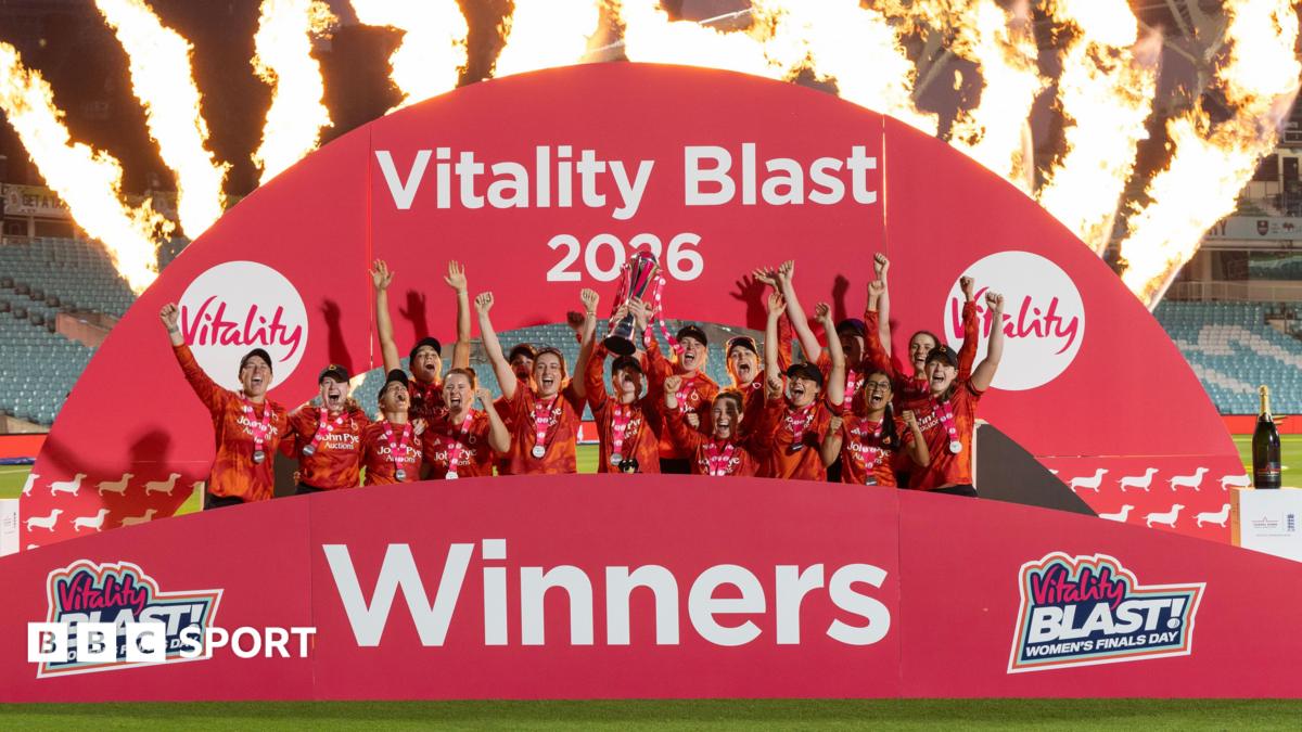 The Blaze team lift the T20 Blast trophy with flames in the background