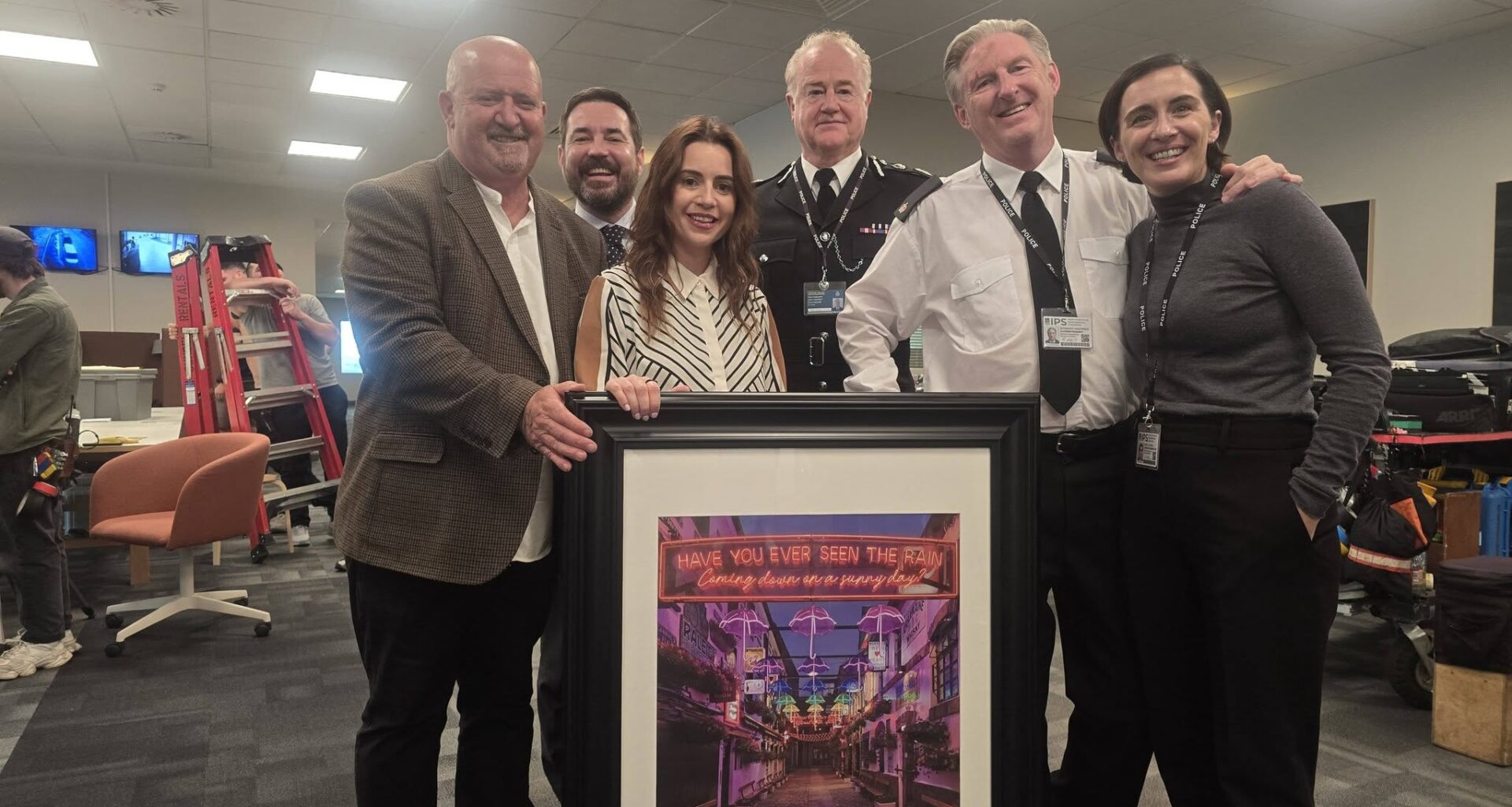 GIFT: John Mallon with Claire McKinley and Line of Duty stars Martin Compston, Owen Teale, Adrian Dunbar and Vicky McClure
