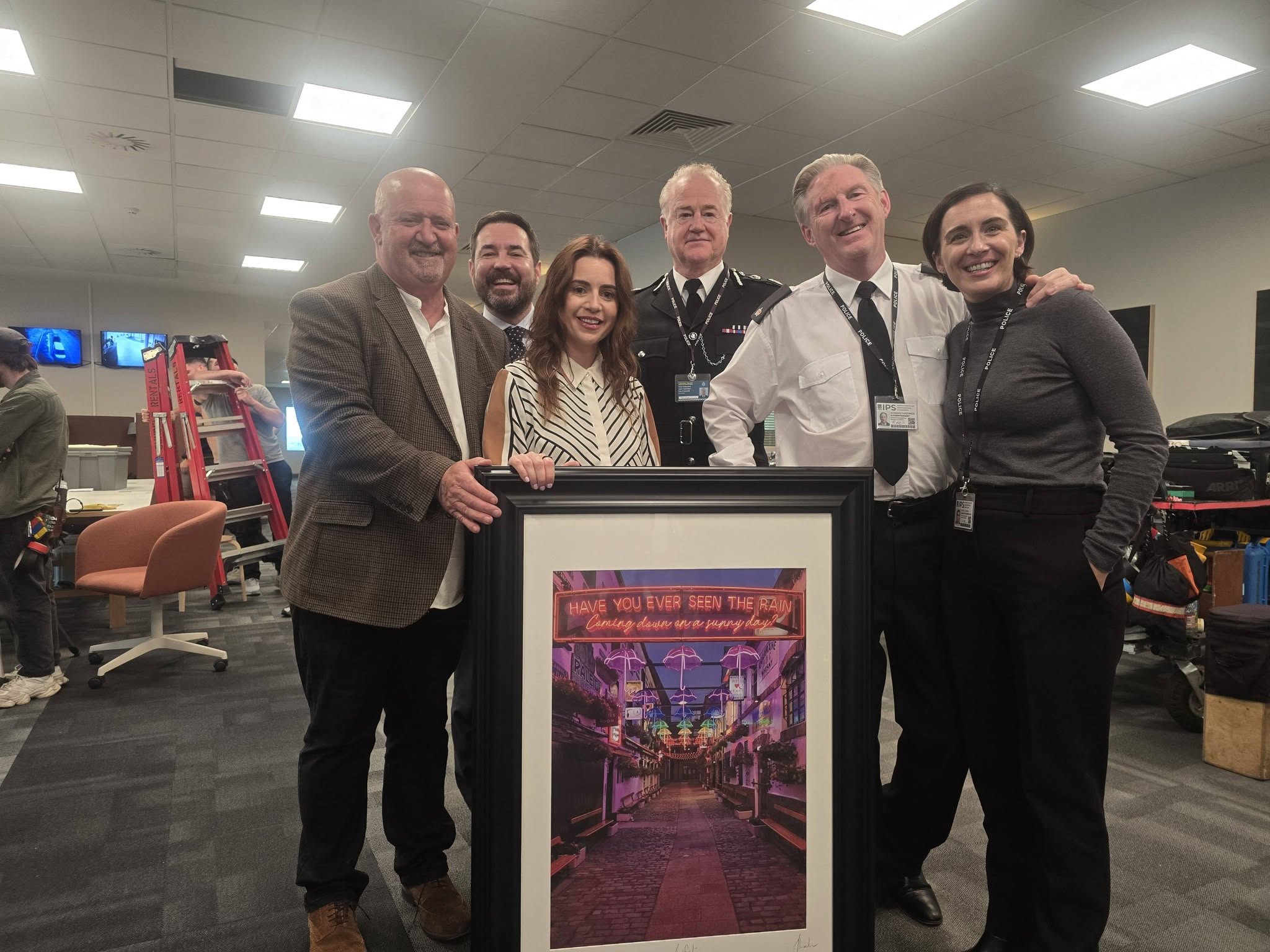 GIFT: John Mallon with Claire McKinley and Line of Duty stars Martin Compston, Owen Teale, Adrian Dunbar and Vicky McClure