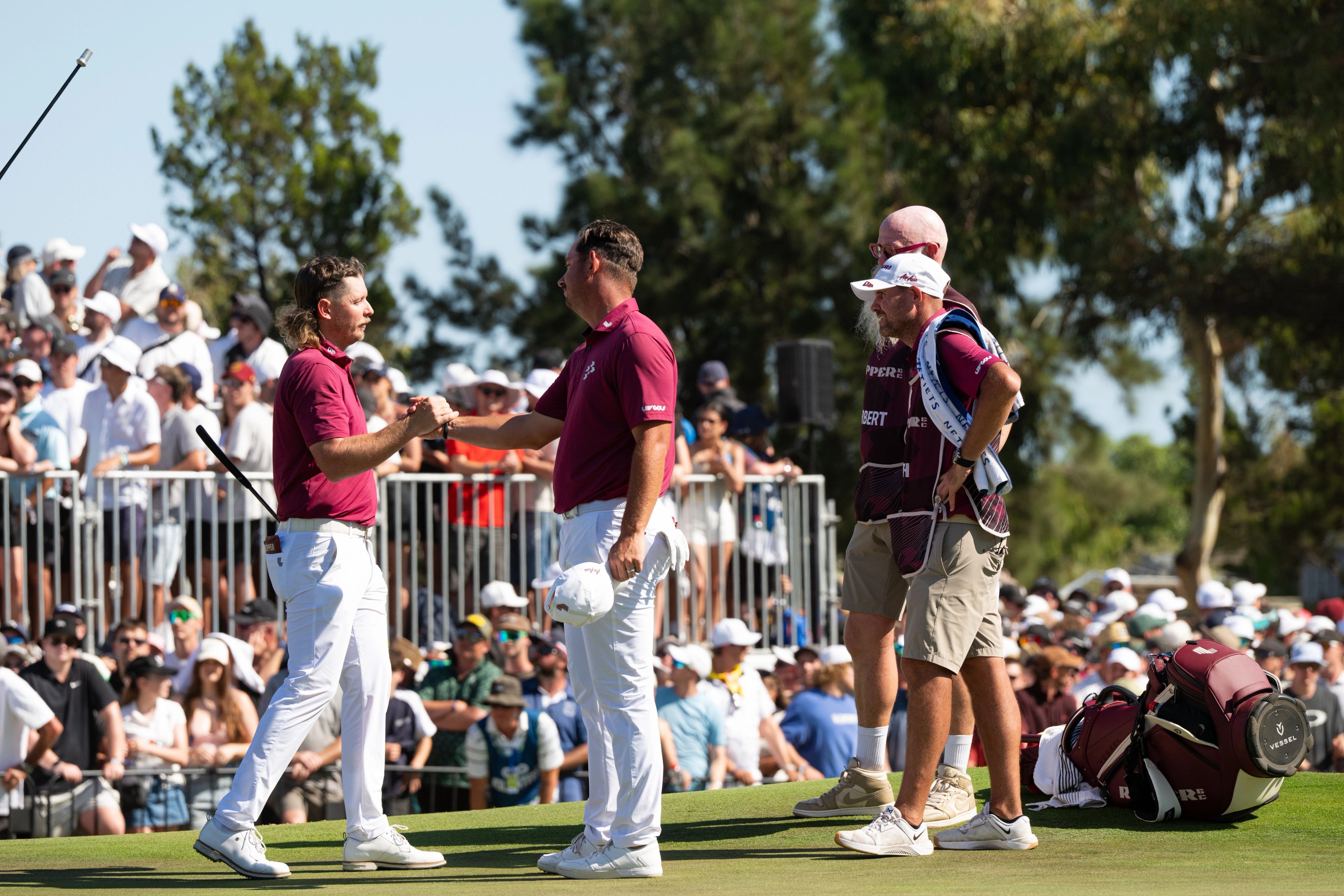 Cameron Smith and Lucas Herbert shake hands at LIV Golf Adelaide in 2026.