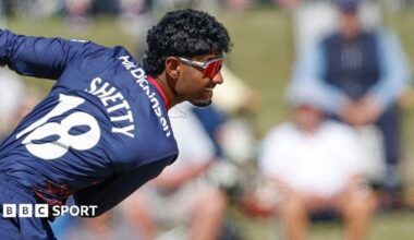 Arav Shetty bowls wearing a blue Lancashire kit