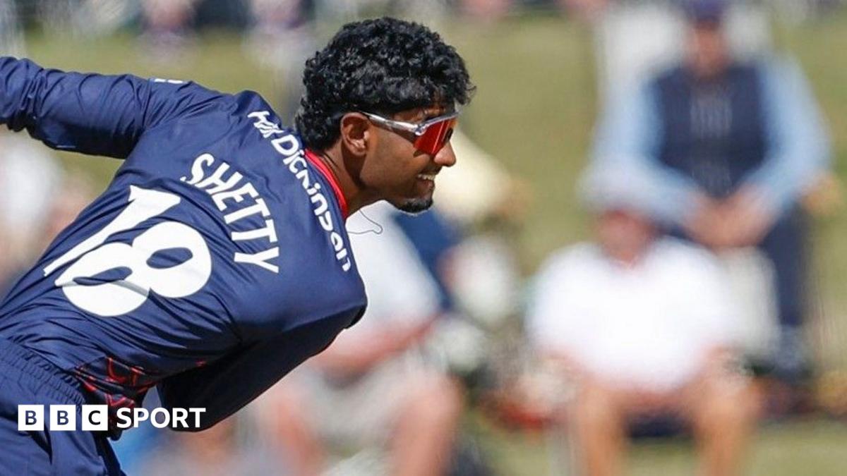 Arav Shetty bowls wearing a blue Lancashire kit