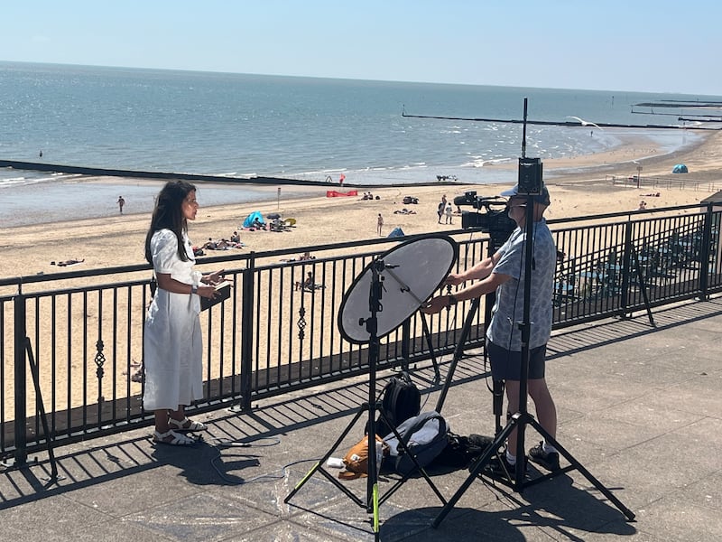 The BBC's Nomia Iqbal filming a live shot on the roof of Clacton Pier's toilets. Photograph: Mark Paul