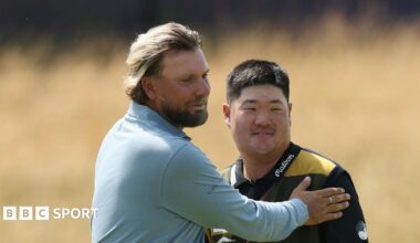 Dan Brown and Im Sung-jae embrace at the end of their round