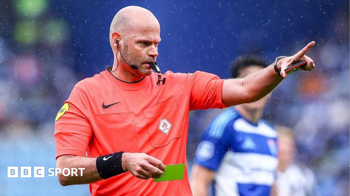 Rob Dieperink holds a yellow card