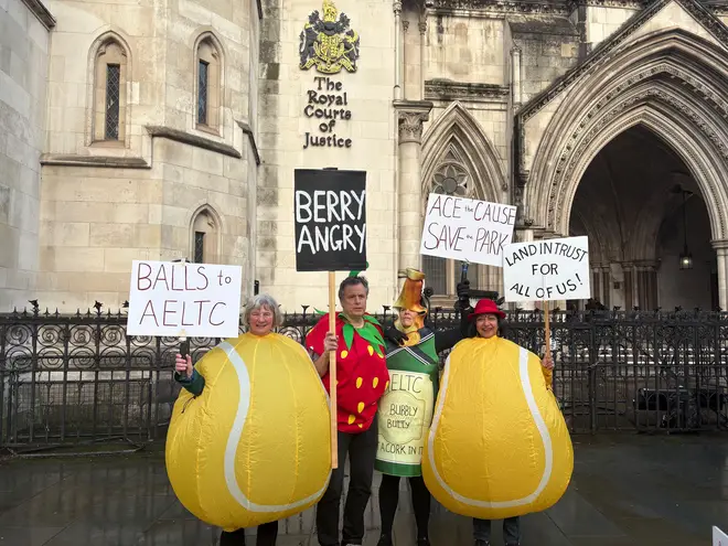 Demonstrators outside the Royal Courts of Justice in London ahead of a hearing between the All En