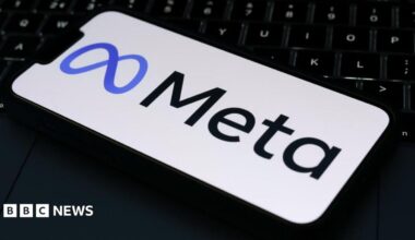 The Meta logo is displayed on a mobile phone