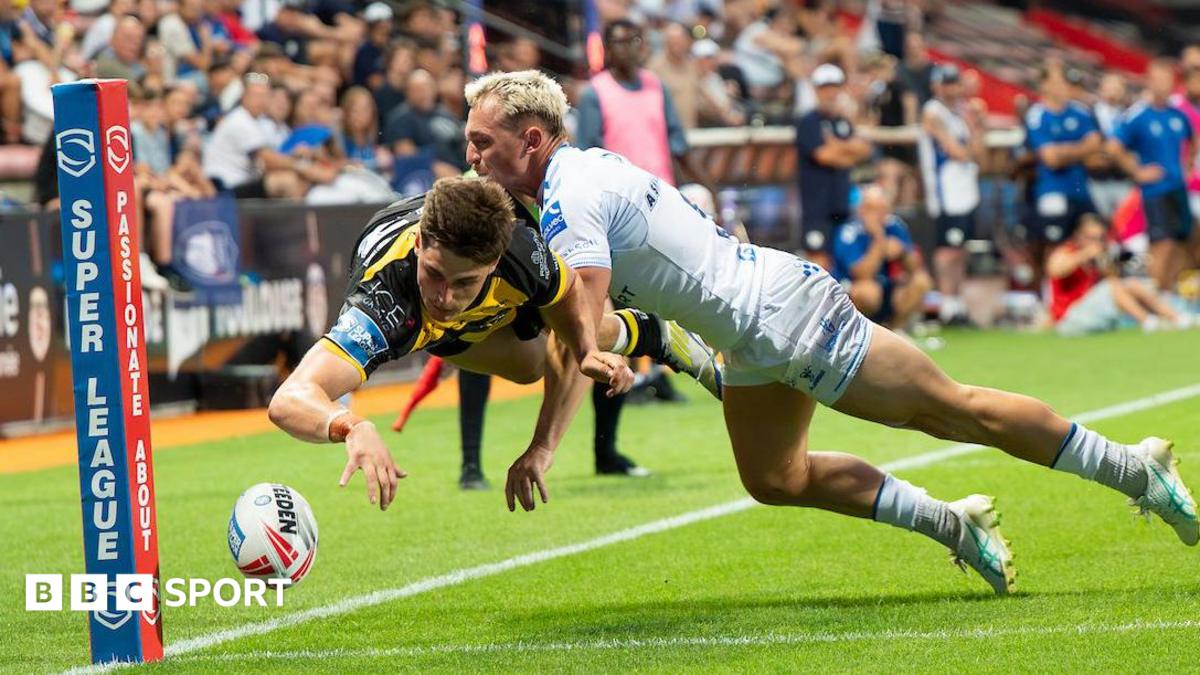 York Knights' Jon Bennison is caught by a try-saving tackle by Toulouse's Olly Ashall-Bott