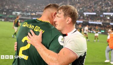 Jac Morgan hugs Malcolm Marx after Wales' defeat by South Africa in Durban
