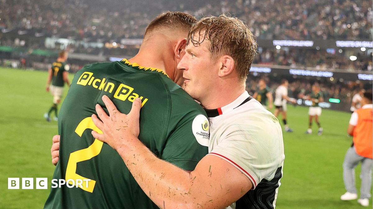 Jac Morgan hugs Malcolm Marx after Wales' defeat by South Africa in Durban