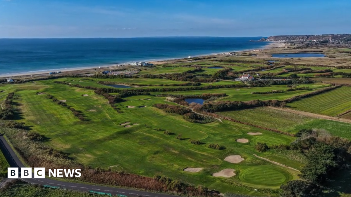 An aerial view of the golf course at Les Mielles. The sea is visible in the background.