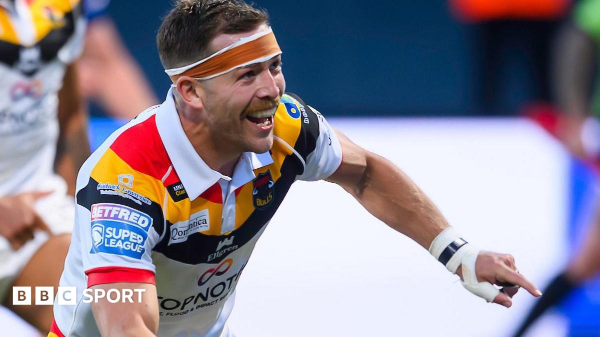 Chris Atkin celebrates scoring a try for Bradford Bulls