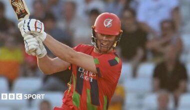 Keaton Jennings batting for Lancashire on a sunny evening in their red T20 kit