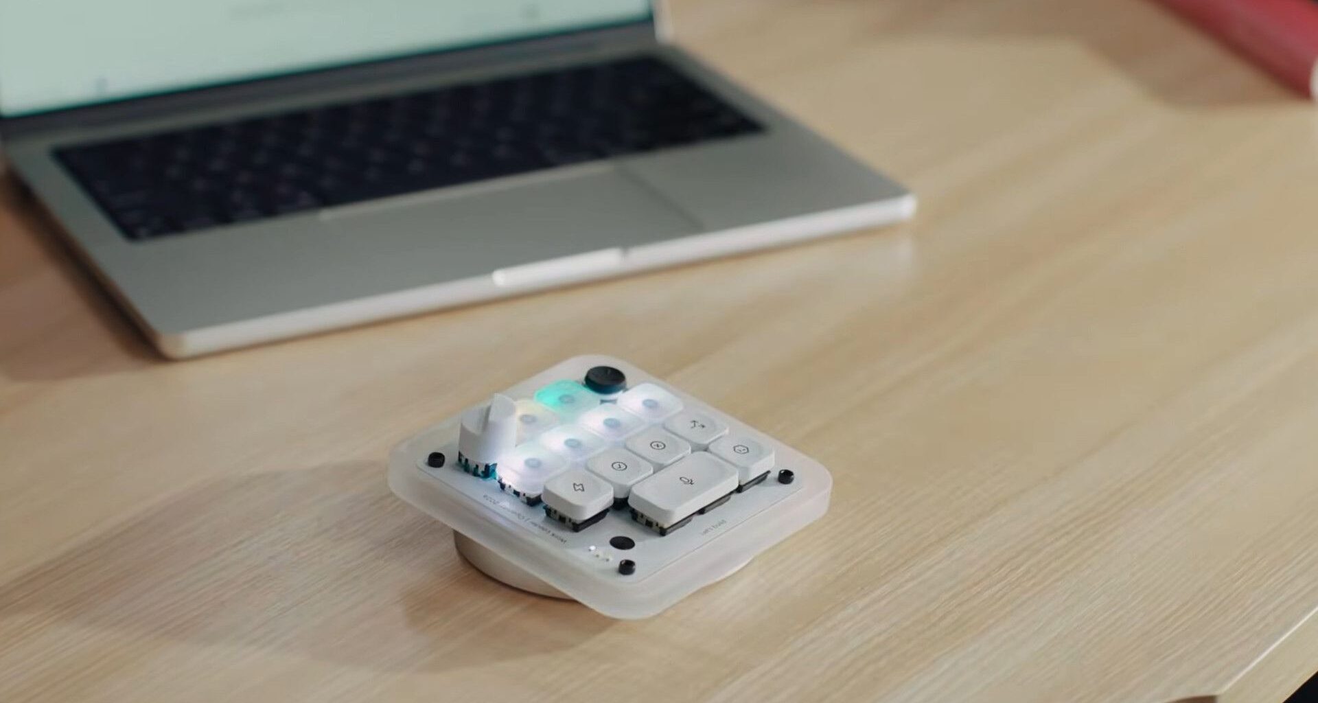 Codex Micro keypad in front of a laptop