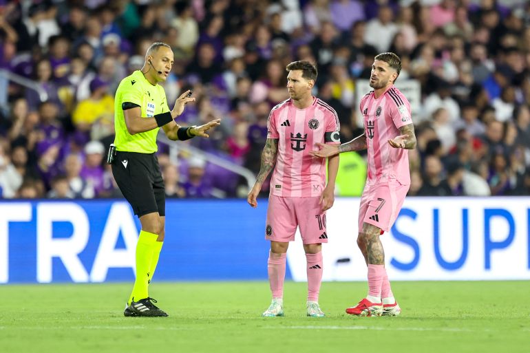 ORLANDO, FLORIDA - MARCH 01: Rodrigo de Paul #7 and Lionel Messi #10 of Inter Miami talk with referee Ismail Elfath during an MLS match between Orlando City SC and Inter Miami CF at Inter&Co Stadium on March 01, 2026 in Orlando, Florida. Dustin Markland/Getty Images/AFP (Photo by Dustin Markland / GETTY IMAGES NORTH AMERICA / Getty Images via AFP)