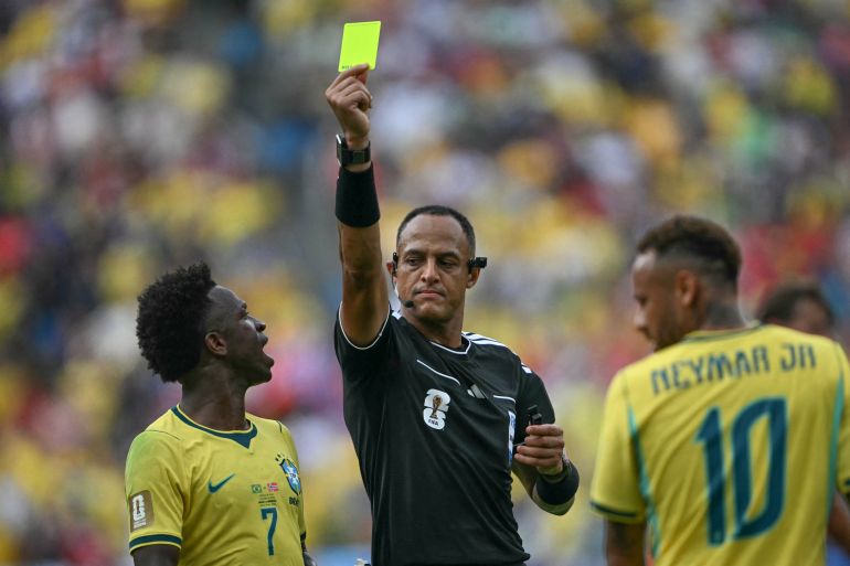 US referee Ismail Elfath shows a yellow card to Brazil's forward #10 Neymar (out of frame) during the 2026 World Cup round of 16 football match between Brazil and Norway at the New York/New Jersey Stadium in East Rutherford on July 5, 2026. (Photo by MAURO PIMENTEL / AFP)