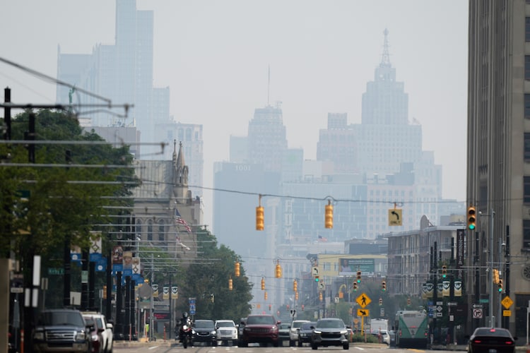 Buildings are seen through haze from wild fires burning in Canada. (Photo: AP)