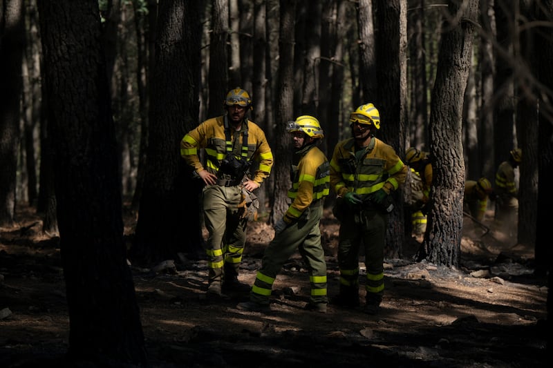 Firefighters during a break while fighting wildfires in a forest near El Tiemblo, Ávila region, Spain, on Wednesday. Photograph: Brais Lorenzo/Bloomberg