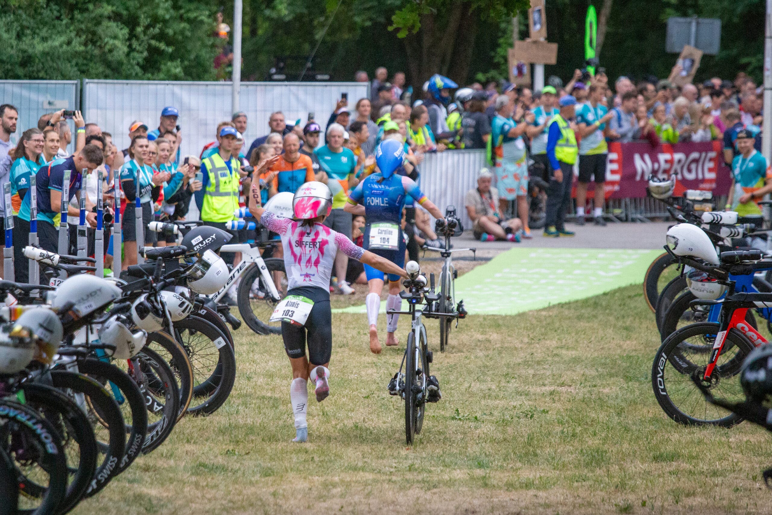 Alanis Siffert rallies the crowd while leaving T1 en route to a win at Challenge Roth 2026.