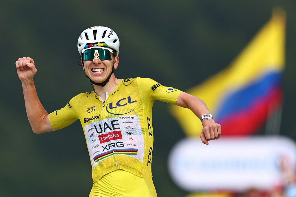 Tadej Pogacar winning the 14th stage of the 113th edition of the Tour de France wearing a MET helmet