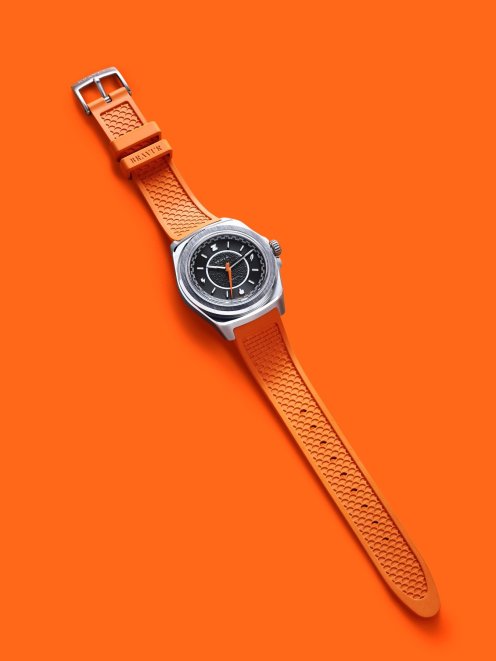 Bravur × Zwift Limited Edition on orange strap, flat-lay