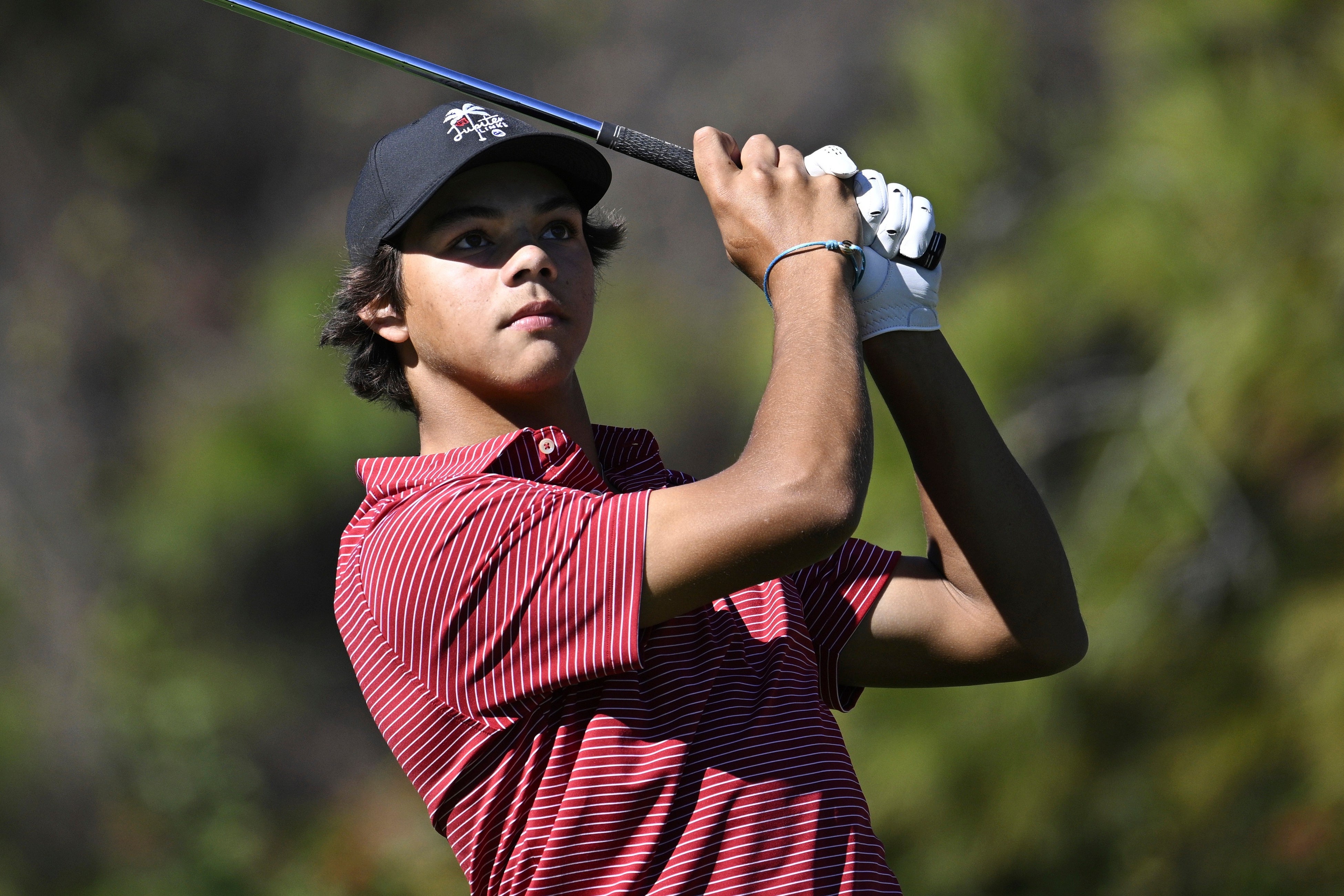 Charlie Woods, 17, was eliminated from the U.S. Junior Amateur Wednesday after a spectator’s phone camera made a noise during a crucial shot