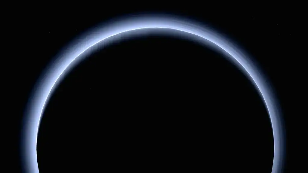 Total solar eclipse with the moon covering the sun, creating a dark sky.