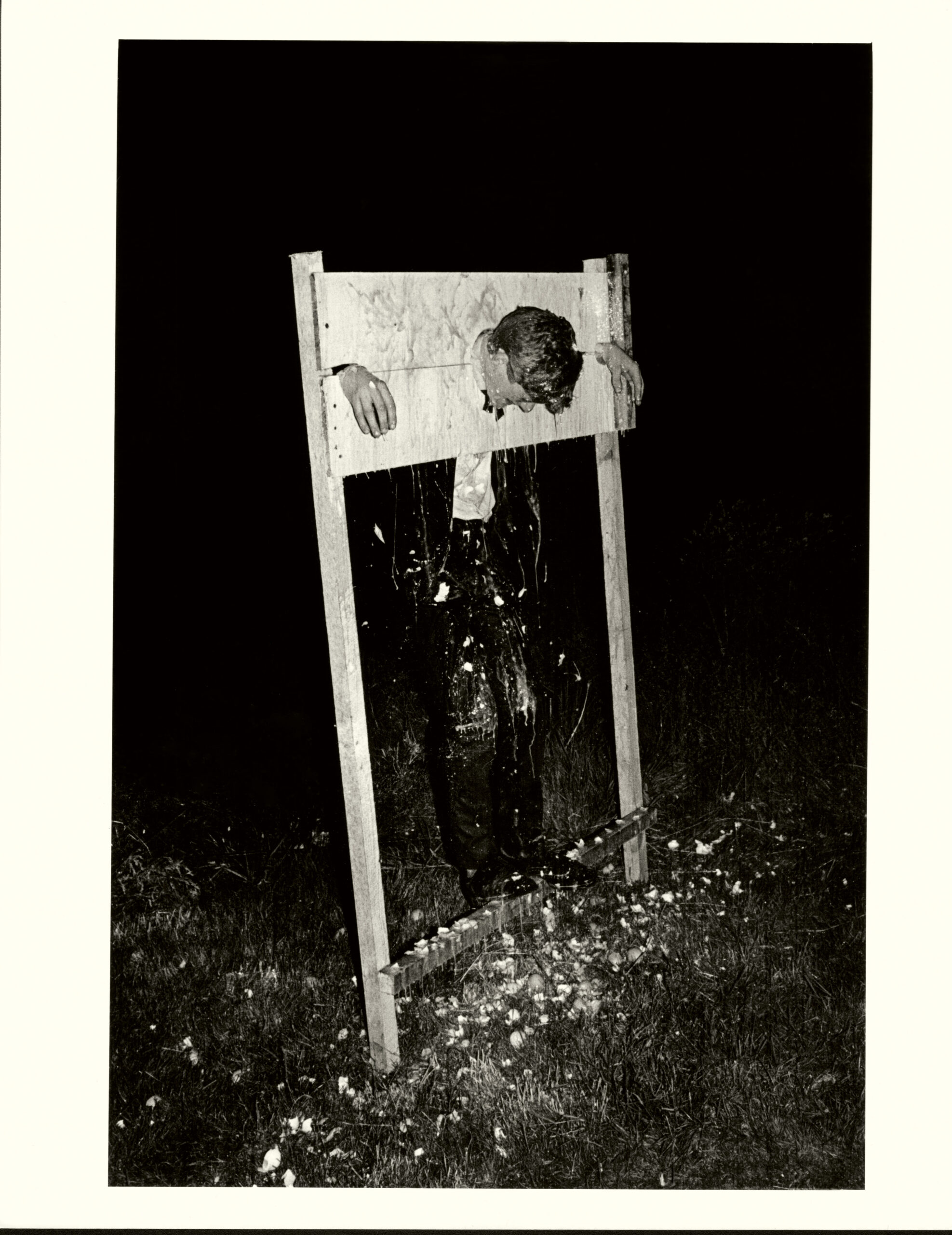 Rob Collins in stocks and covered in eggs during the Cambridge May Ball