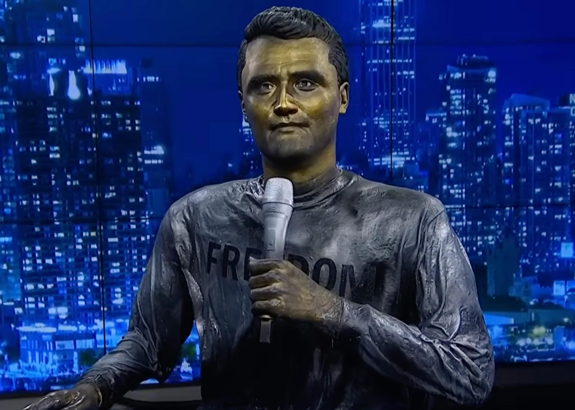 New York sculptor Sergio Furnari's steel and resin Charlie Kirk statue on display in the Newsmax studio