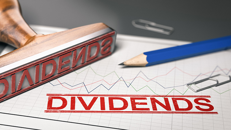 Rubber stamp with the word dividend printed over a stock chart. Concept of investment. 3d illustration.