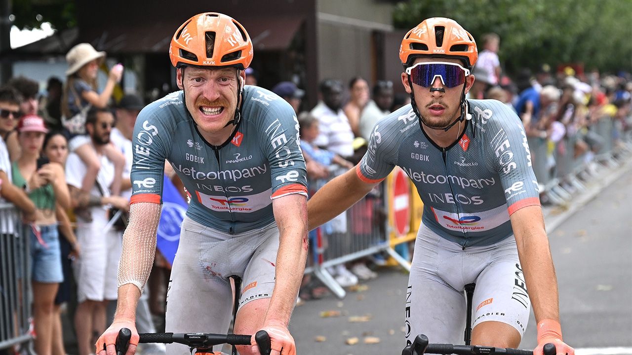 Dorian Godon helped over the line by Netcompany Ineos teammate Kevin Vauquelin after crashing on Stage 12 of the Tour de France (cropped image) (Photo by Dario Belingheri/Getty Images)