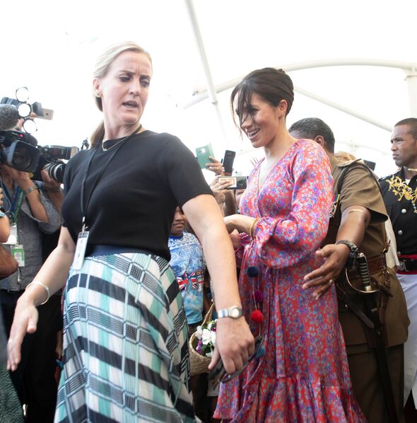 Meghan and a flustered looking aide. Meghan and a flustered looking aide.