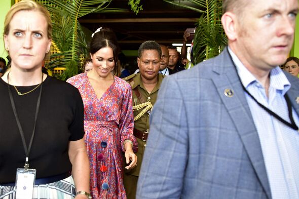 Meghan leaving with aides. Meghan leaving with aides.