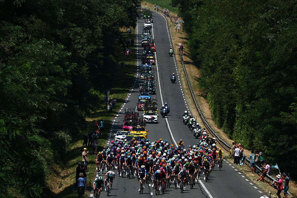The pack of riders (peloton) cycles during the 6th stage of the 113th edition of the Tour de France cycling race, 186,2 km between Pau and Gavarnie-G&egrave;dre in the French Pyrenees, on July 9, 2026. (Photo by Anne-Christine POUJOULAT / AFP)