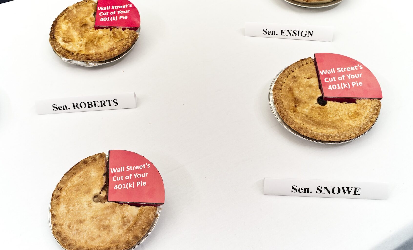 Apple pies sit on a table before a news conference with Rep. George Miller, D-Calif., on Senate Finance Chairman Max Baucus' removal from the "American Jobs and Closing Tax Loopholes Act"  of a provision that would require the disclosure of hidden 401(k) fees. Miller was sending the apple pies to the Senate panel's members, each one missing a piece to symbolize "Wall Street's cut." (Photo by Scott J. Ferrell/Congressional Quarterly/Getty Images)