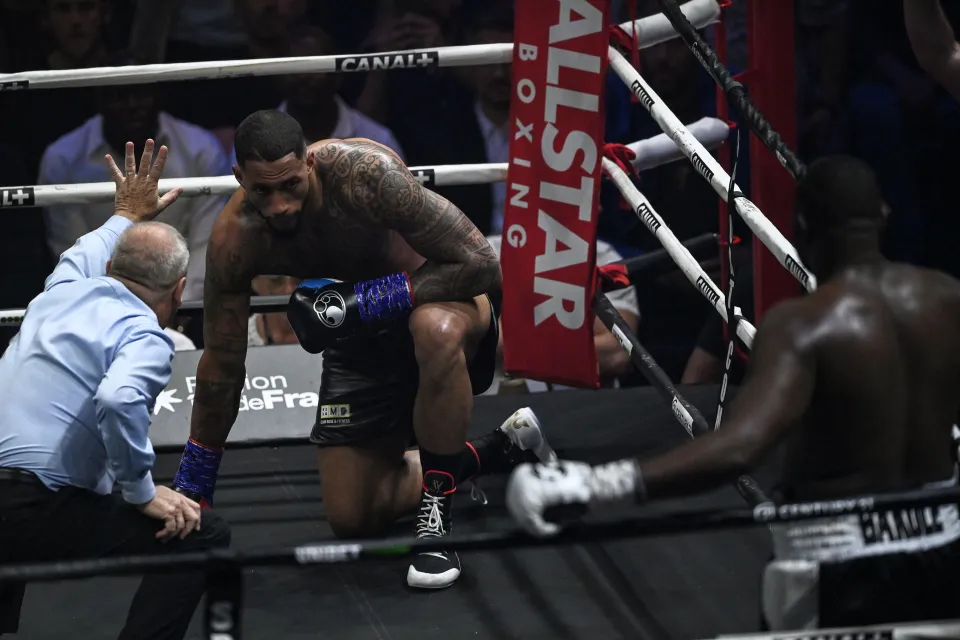 TOPSHOT - France's boxer Tony Yoka (C) reacts during the International Heavyweight 10-round boxing bout against Congolese boxer Martin Bakole (R) at the AccorHotels Arena in Paris, on May 14, 2022. (Photo by Anne-Christine POUJOULAT / AFP) (Photo by ANNE-CHRISTINE POUJOULAT/AFP via Getty Images)