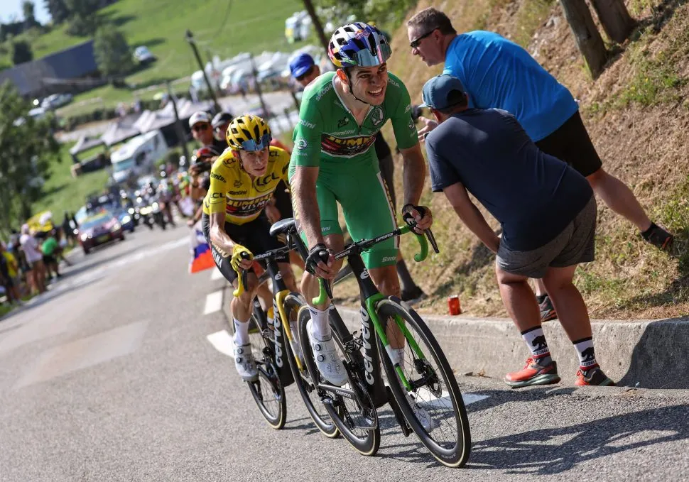 Jumbo-Visma team's Danish rider Jonas Vingegaard wearing the overall leader's yellow jersey (CL) and Jumbo-Visma team's Belgian rider Wout Van Aert wearing the sprinter's green jersey cycle in a breakaway during the final kilometers the 18th stage of the 109th edition of the Tour de France cycling race, 143,2 km between Lourdes and Hautacam in the Pyrenees mountains in southwestern France, on July 21, 2022. (Photo by Thomas SAMSON / AFP) (Photo by THOMAS SAMSON/AFP via Getty Images)