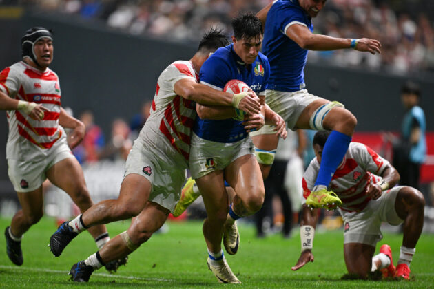 Tommaso Menoncello of Italy is tackled by Shuhei Takeuchi of Japan during the July 2024 international
