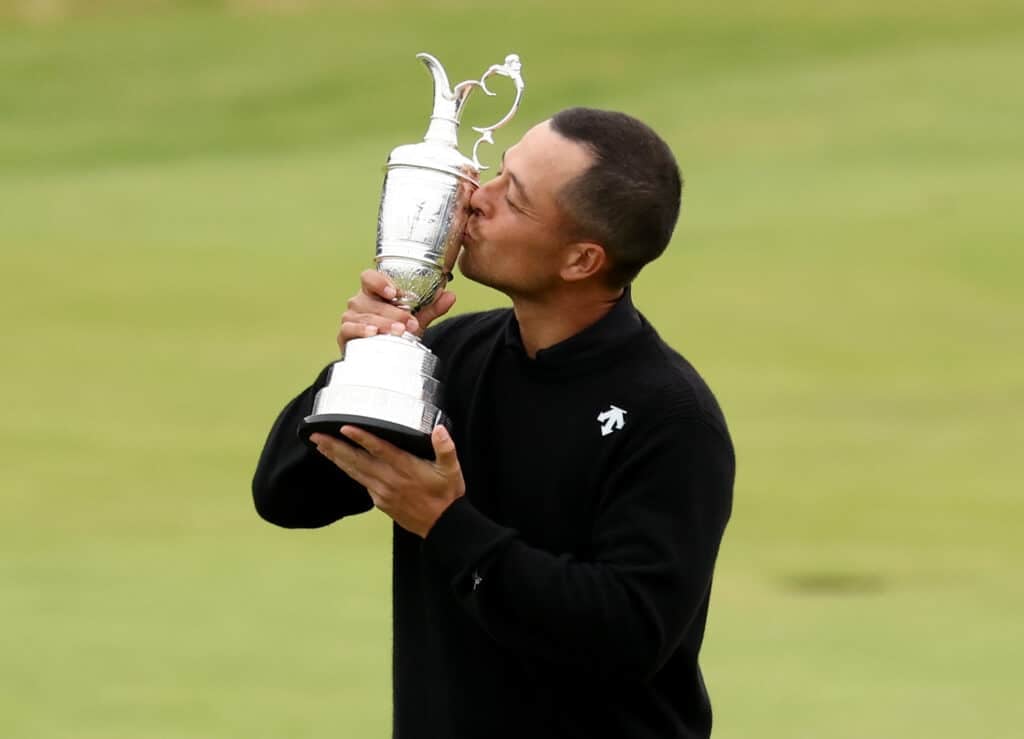 Xander Schauffele poses with the Claret Jug at Royal Troon after winning The Open in 2024 | Source: Getty Images
