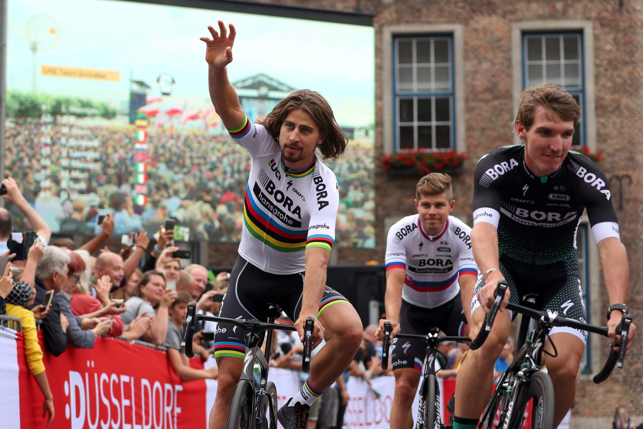 Peter Sagan, pictured in 2010, raises his hand to acknowledge fans