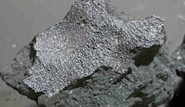 Meteorite strike of New Jersey home: Gray chunk of rock that is more silvery on top, with a wrinkled texture.