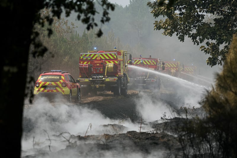 Firefighters carry out mop-up operations, extinguishing remaining hot spots and  smoldering patches, in a forest near Marcheprime, some 30km from Bordeaux, on Monday, as a wildfire rages through the forest in Gironde, southwestern France. Photograph: Getty Images