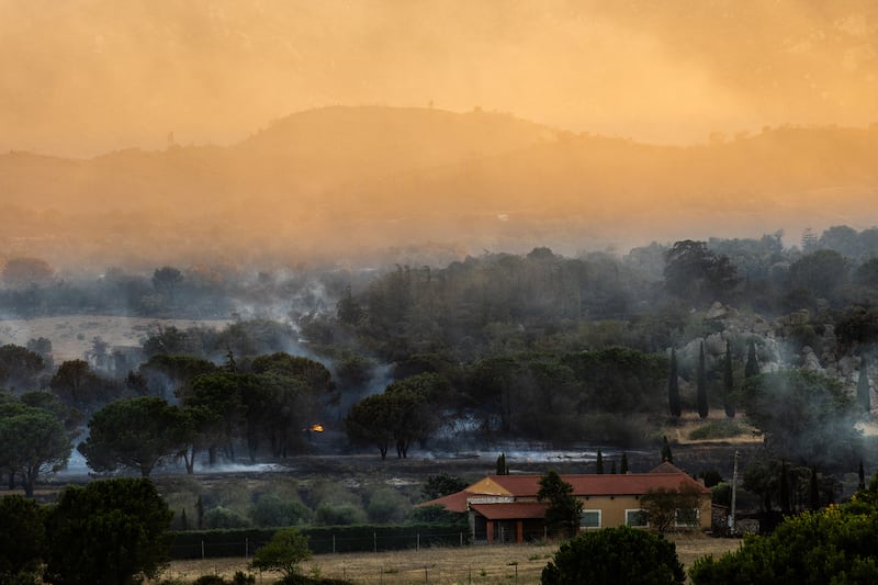 Smoke billows after a wildfire passed through the outskirts of Montalba-le-Chateau, in the Pyrenees-Orientales department. Photograph: JC Milhet/AFP via Getty Images