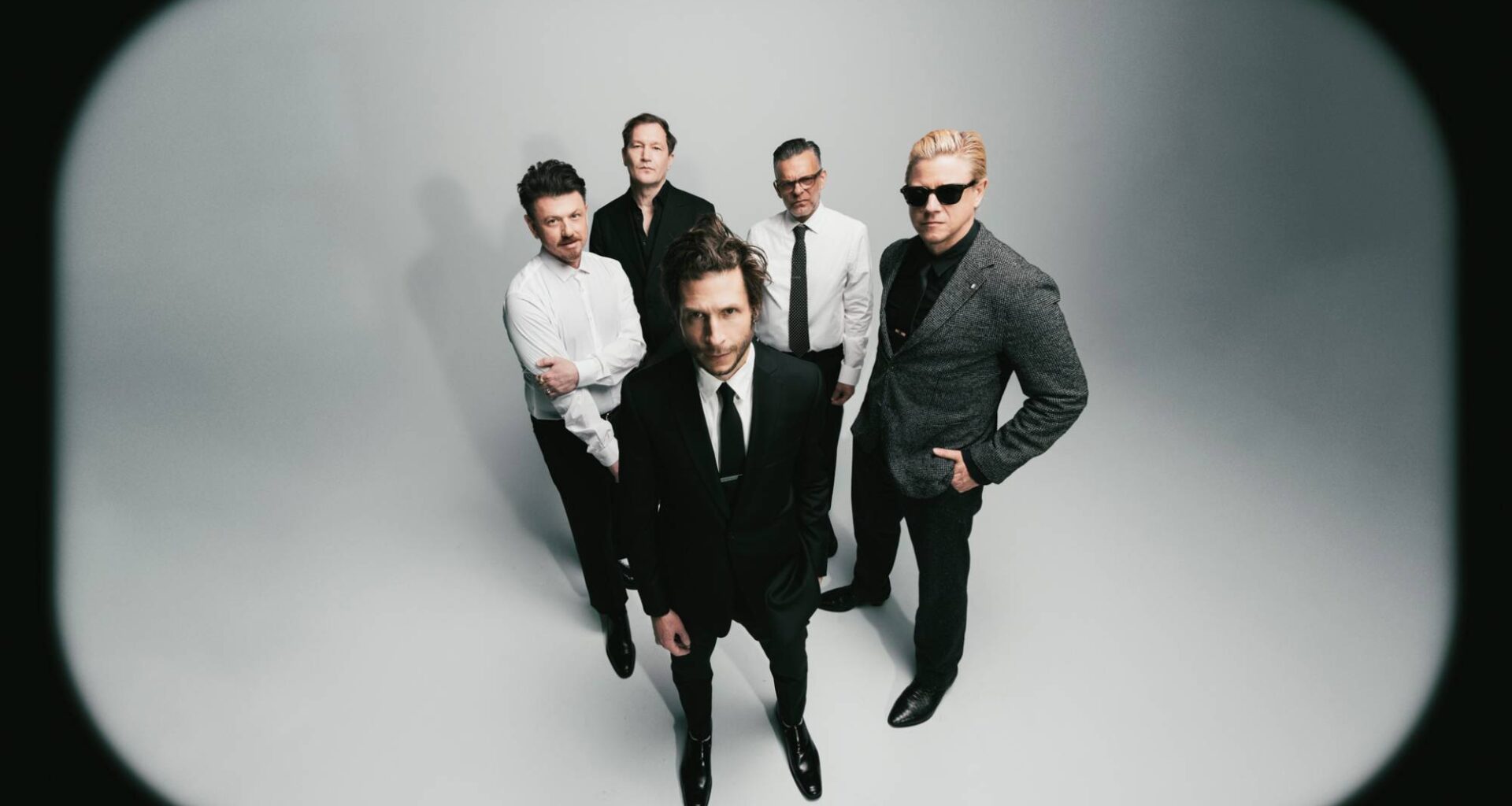 Interpol stare down AI on atmospheric new single 'Iron City'