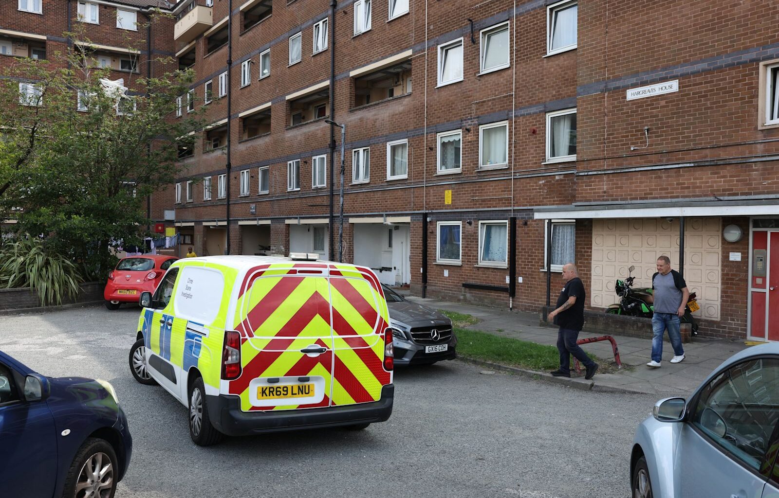 Woman charged with murder after 75-year-old pensioner found dead in Bolton