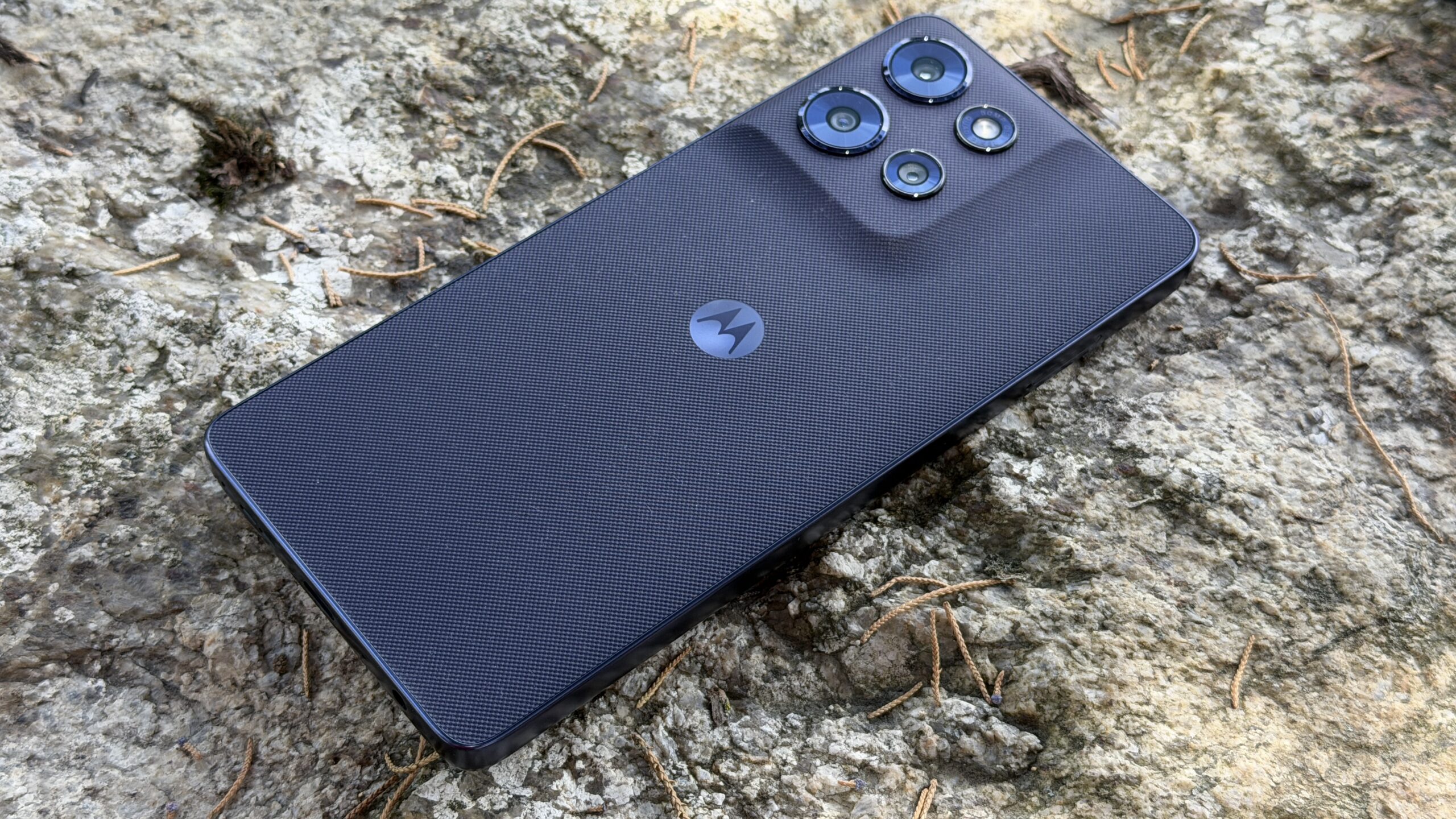 Moto G Power 2026 sitting on a rock Moto G Power 2026 sitting on a rock