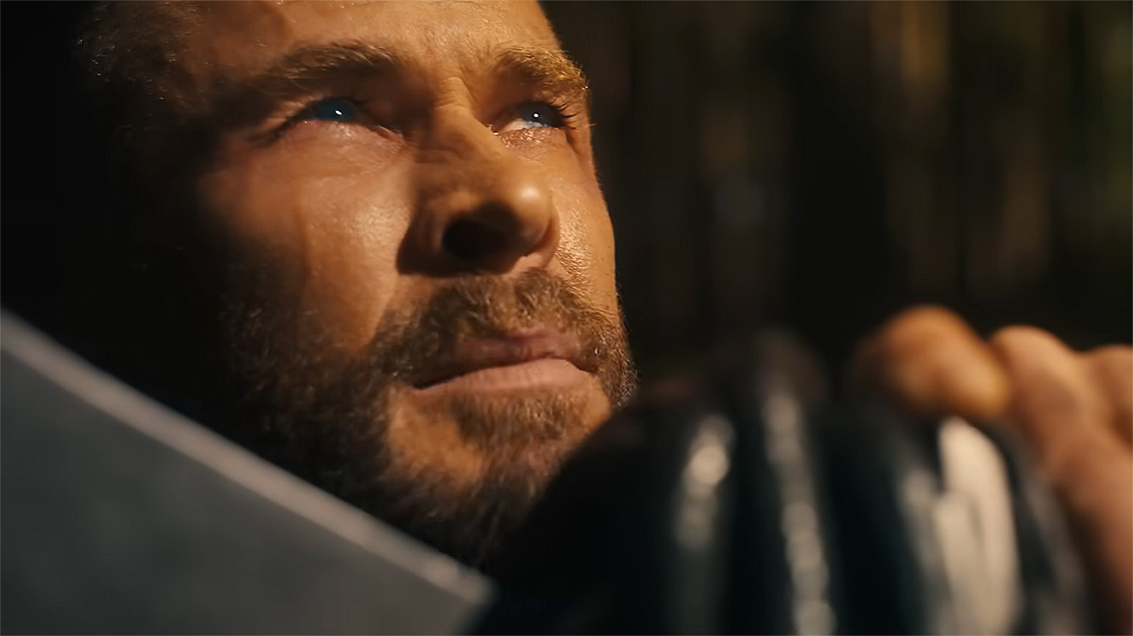 Thor looking up to the sky with his right hand on Stormbreaker in Avengers: Doomsday