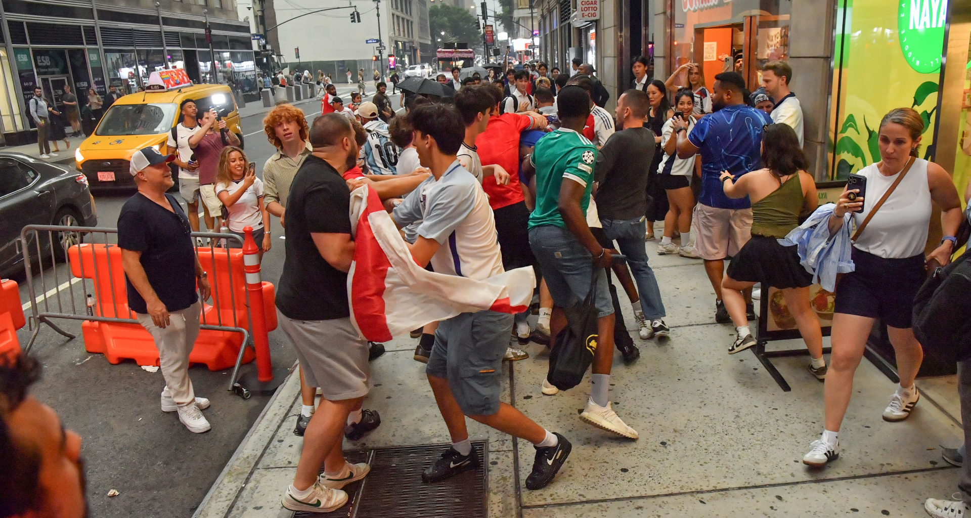 England fans involved in furious punch-up in New York on night of World Cup defeat