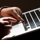 File photo dated 26/05/22 of a child using a laptop computer. More than 1.6 million social media accounts owned by children are falsely registered with an adult age, a survey by the advertising regulator suggests. Some 93% of young people aged 11 to 17 say they have an account with Facebook, Instagram, Snapchat, TikTok, Twitch, Twitter or YouTube, with a quarter (24%) misreporting their age when doing so, the Advertising Standards Authority (ASA) found. Issue date: Tuesday November 29, 2022. PA Photo. See PA story CONSUMER Children. Photo credit should read: Dominic Lipinski/PA Wire
