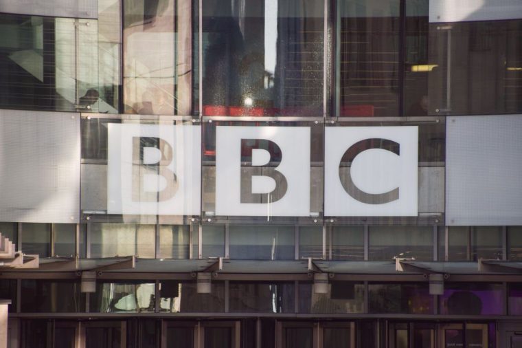 LONDON, UNITED KINGDOM - 2022/01/17: The BBC logo is seen at the entrance at Broadcasting House, the BBC headquarters in central London. The UK government has announced it will freeze the broadcaster's budget for the next two years and will end the license fee in 2027. (Photo by Vuk Valcic/SOPA Images/LightRocket via Getty Images)